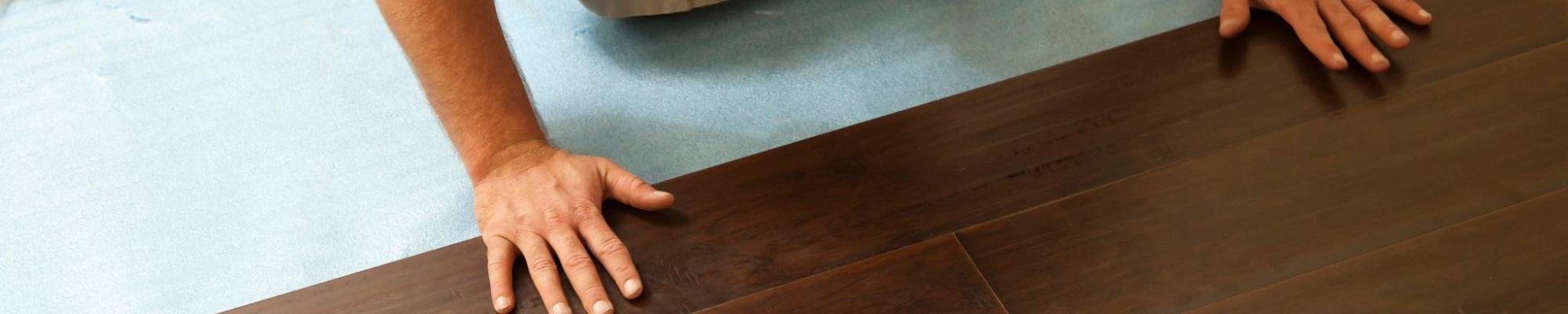 The interior of a living room with hardwood floors and carpet